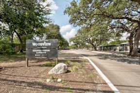 Property Sign at Woodview Apartments, Austin