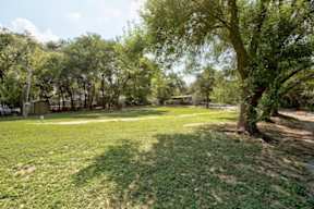 Home Garden Exterior at Woodview Apartments, Austin, TX