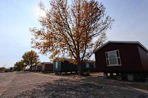 a row of tiny houses on the side of a road at Country Lane, Cheyenne