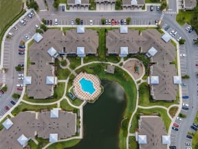 arial view of a housing complex with a swimming pool in the middle