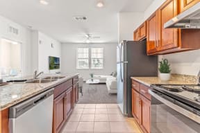 a kitchen with wooden cabinets and stainless steel appliances