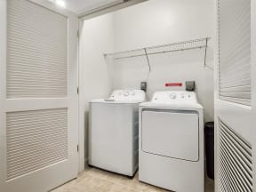 a washer and dryer in a room next to a door