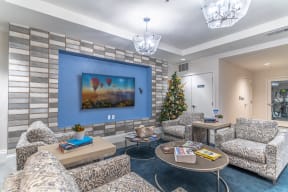 a living room with a christmas tree and couches