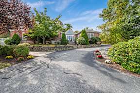 House with driveway at Four Winds Apartments, Fall River