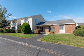 A residential area with houses and a clear sky.