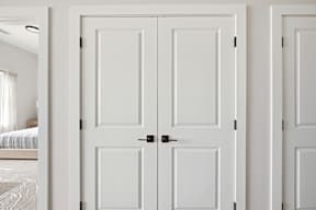 Three white doors in a row.