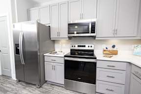 Kitchen with stove top oven at Park Circle Village Apartments, North Charleston, SC