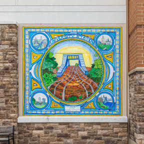 a mural on the side of a brick building