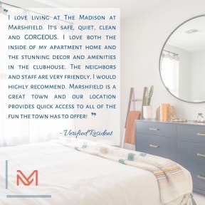 a bedroom with a bed and a mirror
