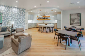 a large living room with a kitchen and a dining room, The Maggie, Luxury Apartments Raleigh, NC