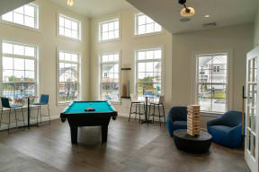 a games room with a pool table and jenga