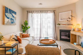 a living room filled with furniture and a large window