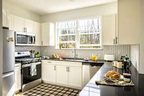 a kitchen with a stove and a sink