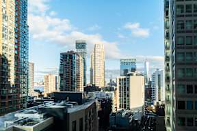 a city skyline with tall buildings and skyscrapers