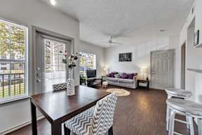 an open living room and dining room with a table and chairs