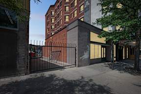 A building with a gate in front of it.