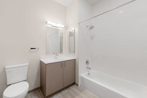 a bathroom with a sink toilet and a tub