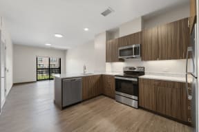 a kitchen with wooden cabinets and stainless steel appliances