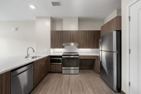 a kitchen with wooden cabinets and stainless steel appliances