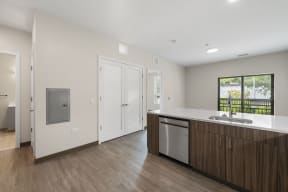a kitchen with a sink and a counter top in a house