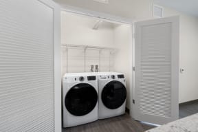 a laundry room with a washing machine and a dryer