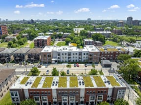 an aerial view of a building with a green roof