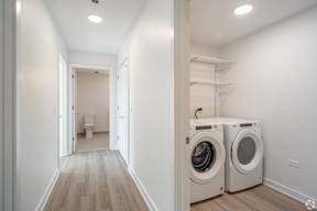 A laundry room with a washer and dryer.