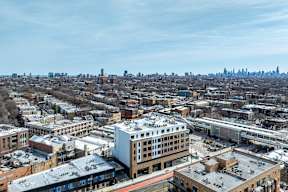 A cityscape with buildings and a clear sky.
