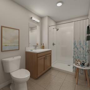 A white toilet sits next to a sink in a bathroom.