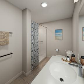 A bathroom with a white sink and a blue shower curtain.