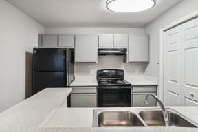 Kitchen with white cabinets at Wellington Farms, Charlotte, NC