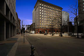 A street view of a city with a fire hydrant in the foreground.