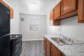 our apartments offer a kitchen with a sink and a stove