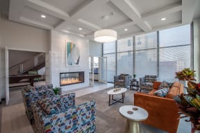 a living room with couches and chairs and a fireplace