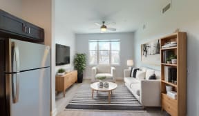 a living room with a white couch and a coffee table at City Square 162