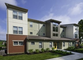 a view of the exterior of an apartment building