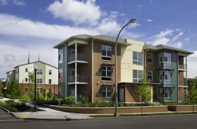 a row of apartment buildings on a city street