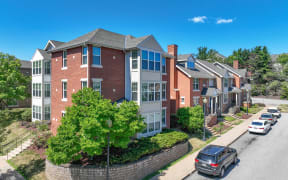 an aerial view of an apartment building on a city street at Crawford Square Apartments & Townhomes