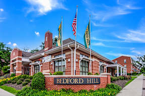 Bedford Hill building with American flag on top.