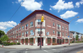 a red brick building on the corner of a street