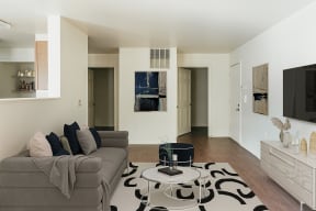 a living room with a couch and a table at Horace Mann apartments and townhomes in Gary, IN