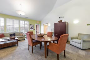 a community room with a dining room table and chairs at Horace Mann apartments and townhomes in Gary, IN