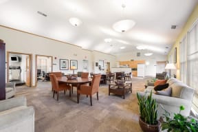 Community room with seating areas and a kitchenette at Horace Mann apartments and townhomes in Gary, IN