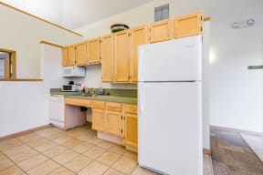 a kitchenette in the community room with a sink and a refrigerator at Horace Mann apartments and townhomes in Gary, IN