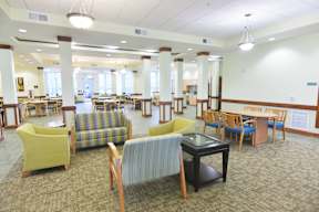 A room with tables and chairs.