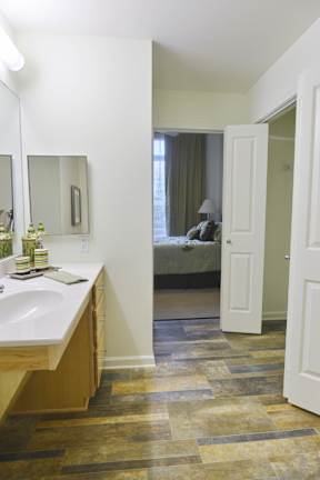 A bathroom with a sink and a mirror.