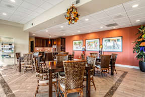 A room with a lot of chairs and tables.