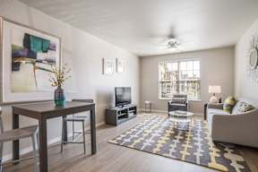 A living room with a brown table and a television.