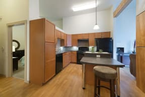 a kitchen with an island in the middle of it