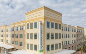 a large building with a sign in front of it